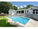 In-ground pool with back yard play set, patio, and porch areas at 448 Stonewood Ln, Maitland, FL 32751