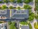 An aerial view of residences with parking, roads and lush trees at 4584 Virginia Dr, Orlando, FL 32814