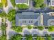 Aerial view of a multi-Gathering residence, lush landscaping, and ample parking spaces at 4584 Virginia Dr, Orlando, FL 32814