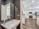 Stylish powder room with modern fixtures adjacent to the bright kitchen at 4584 Virginia Dr, Orlando, FL 32814