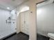 Elegant bathroom featuring a tiled shower with glass door and custom built-in storage at 4584 Virginia Dr, Orlando, FL 32814