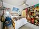 Bedroom with unique decor, ceiling fan, and built-in storage at 4584 Virginia Dr, Orlando, FL 32814