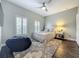Cozy bedroom featuring plantation shutters and a ceiling fan, perfect for relaxing and unwinding at 4584 Virginia Dr, Orlando, FL 32814