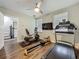 Well-equipped home gym with a treadmill, stationary bike, and rowing machine at 4584 Virginia Dr, Orlando, FL 32814
