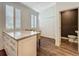 Breakfast nook featuring wood-look flooring, bright windows, and counter seating at 4584 Virginia Dr, Orlando, FL 32814