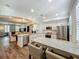 Bright open kitchen with island, dining and living space beyond at 4584 Virginia Dr, Orlando, FL 32814