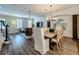 Open-concept living space with fireplace, dining area, and cozy seating at 4584 Virginia Dr, Orlando, FL 32814