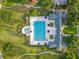Aerial shot of community pool area featuring in ground spa, loungers, and manicured gardens at 4584 Virginia Dr, Orlando, FL 32814