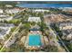 Overhead shot of a luxurious pool area in the middle of a residential neighborhood and lake views at 4584 Virginia Dr, Orlando, FL 32814