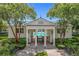 The pool house is framed by trees and features a covered entry to a community pool at 4584 Virginia Dr, Orlando, FL 32814
