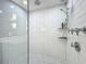 Modern shower with subway tile, mosaic floor, rainfall showerhead, and chrome fixtures at 4584 Virginia Dr, Orlando, FL 32814