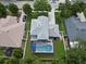 Aerial view of a home with a screened-in pool and a well-maintained yard at 486 Shirley Dr, Apopka, FL 32712