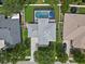 An aerial view shows the home and surrounding neighborhood with a large in-ground pool at 486 Shirley Dr, Apopka, FL 32712