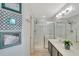 Bright bathroom with a shower, sink and decorative wall art at 486 Shirley Dr, Apopka, FL 32712