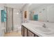 Neutral toned bathroom with large mirror over the vanity, and a shower/tub combination at 486 Shirley Dr, Apopka, FL 32712