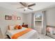 Bright bedroom with a ceiling fan, a large window, and playful Tennessee Volunteers decor and memorabilia at 486 Shirley Dr, Apopka, FL 32712