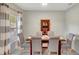 Cozy dining room featuring a wooden table, upholstered chairs, and soft natural light at 486 Shirley Dr, Apopka, FL 32712