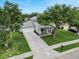 Charming two-story home with an attached two-car garage, manicured lawn, and inviting front porch at 486 Shirley Dr, Apopka, FL 32712