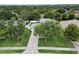 Aerial view of a home featuring a well-kept lawn and a long driveway at 486 Shirley Dr, Apopka, FL 32712