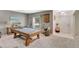This stylish game room offers the perfect space for fun with a beautiful pool table and neutral decor at 486 Shirley Dr, Apopka, FL 32712