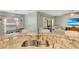 Kitchen features granite countertops, stainless steel sink, and an open view to the dining area and living room at 486 Shirley Dr, Apopka, FL 32712