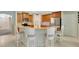 Kitchen with tile floors, wooden cabinets, stainless steel appliances, and a granite countertop island with seating at 486 Shirley Dr, Apopka, FL 32712
