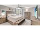 Spacious main bedroom with neutral decor, a large window, a ceiling fan, and ample natural light at 486 Shirley Dr, Apopka, FL 32712