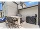 Outdoor kitchen features counter seating and built-in grill in this screened in lanai at 486 Shirley Dr, Apopka, FL 32712