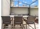 Built in outdoor kitchen features counter seating for four in this screened in pool and patio area at 486 Shirley Dr, Apopka, FL 32712