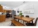 Bright dining room with a wooden table and bench seating at 531 Wigman Dr, Eatonville, FL 32751