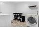 Practical laundry room with modern appliances, a folding table, and ample space for organization at 531 Wigman Dr, Eatonville, FL 32751