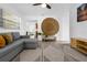 Cozy living room with modern decor, a comfortable gray sofa, and textured rug at 531 Wigman Dr, Eatonville, FL 32751