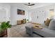 Bright living room with white walls, tile flooring, and stylish furnishings at 531 Wigman Dr, Eatonville, FL 32751