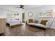 Serene bedroom featuring a comfortable sofa and sliding glass door at 531 Wigman Dr, Eatonville, FL 32751
