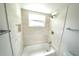 Bathroom with new tile in the shower with bathtub at 5472 E Grant St, Orlando, FL 32812