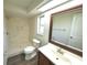 Updated bathroom with tile shower, new toilet, and vanity at 5472 E Grant St, Orlando, FL 32812