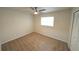 Bedroom with neutral carpet, window, ceiling fan, and built-in closet at 5472 E Grant St, Orlando, FL 32812
