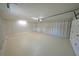 Clean two-car garage with storage area and access door at 5472 E Grant St, Orlando, FL 32812