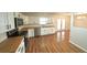 Kitchen with stainless steel appliances, wood countertops, and white cabinets at 5472 E Grant St, Orlando, FL 32812