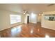 Bright living room with hardwood floors and a ceiling fan at 5472 E Grant St, Orlando, FL 32812