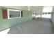 Covered patio space offering a ceiling fan and view of yard at 5472 E Grant St, Orlando, FL 32812