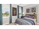 Nicely decorated bedroom with a large window with a view, playful decor, and plush carpet at 5626 Portico Pl, Kissimmee, FL 34758