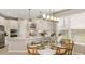 Bright, open kitchen featuring white cabinetry, quartz countertops, and stainless steel appliances at 5626 Portico Pl, Kissimmee, FL 34758