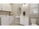 Efficient laundry room featuring modern appliances, storage, and a convenient sink area at 5626 Portico Pl, Kissimmee, FL 34758