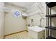 Laundry room with utility sink, shelving, and octagonal window at 5836 Spruce Creek Woods Dr, Port Orange, FL 32127
