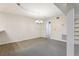 Cozy living area with plush carpet, classic lighting, and convenient access to other rooms at 5836 Spruce Creek Woods Dr, Port Orange, FL 32127