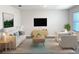 Comfortable living room with stylish furniture, decorative accents, and ample natural light at 613 Hickory Course Loop, Ocala, FL 34472