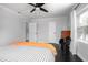 Bright bedroom featuring hard wood floors, light-colored walls, and ample natural light from the window creating a calming space at 627 N Cherokee Ave, Deland, FL 32724