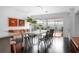Dining room with a long white table and view into the backyard at 627 N Cherokee Ave, Deland, FL 32724