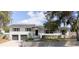Beautiful two-story home with brick wall, mature landscaping and two car garage at 627 N Cherokee Ave, Deland, FL 32724